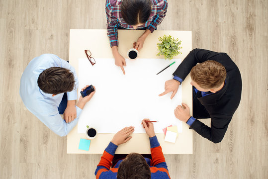 Top view table with group of working people