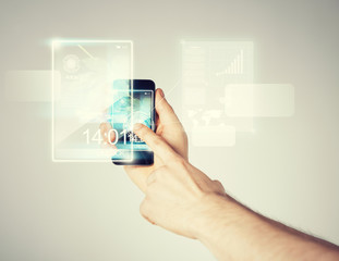 man hand with smartphone and virtual screen