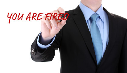 Businessman writing You are fired on screen isolated on white