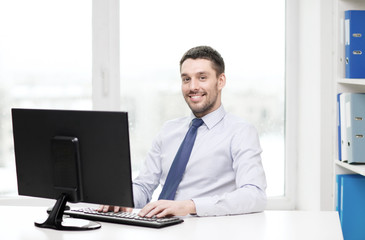 smiling businessman or student with computer