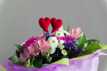 Red hearts and a bouquet of flowers