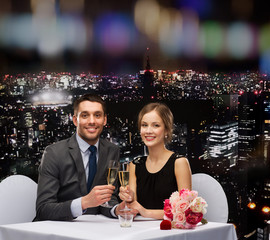 couple with glasses of champagne at restaurant