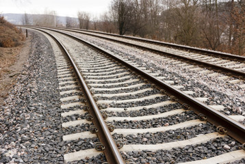 Obraz na płótnie Canvas Train tracks curving left.