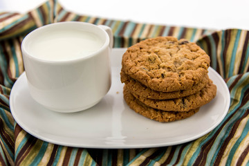 oatmeal raisin cookies and cup of milk