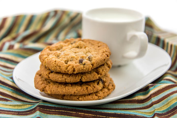 oatmeal raisin cookies and cup of milk