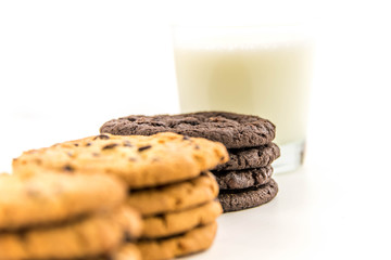 variety of cookies and glass of milk