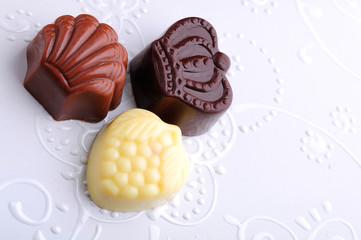 chocolate candy on white background with place for text