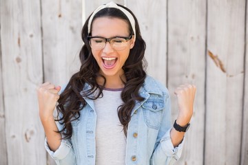 Pretty hipster cheering and smiling