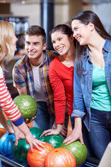 Fototapeta premium happy friends in bowling club