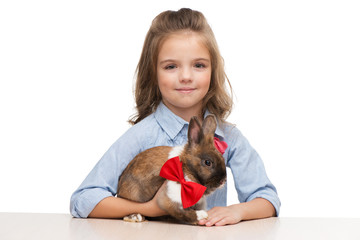 Girl looking at camera with bunny