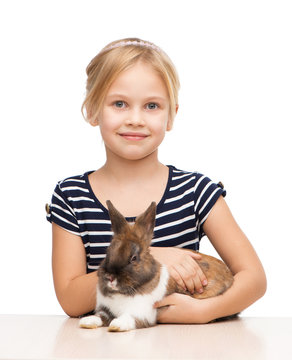 Cute girl looking at camera with bunny