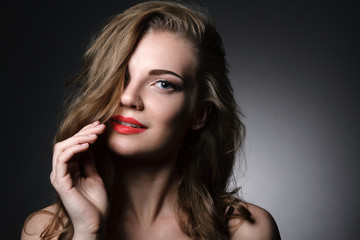 Beautiful caucasian young woman with red lips make up