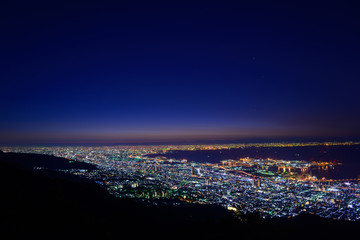 Naklejka premium Osaka and Kobe in the twilight, View from the Kukuseidai of Mt.M
