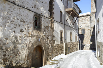 Fototapeta na wymiar Snowy street, town of Ortigosa de Cameros, La Rioja, Spain