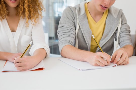 Students Taking Notes In Class