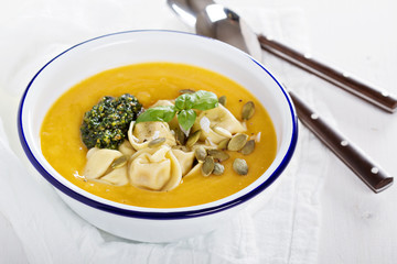 Pumpkin cream soup with cheese tortellini