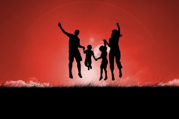 Silhouette of family jumping