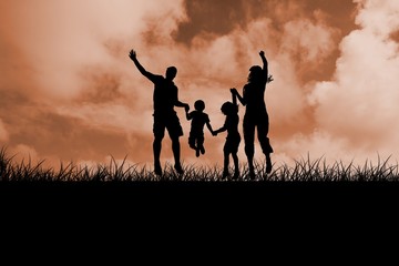 Silhouette of family jumping