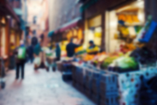 Old market in italian city. Blurred and filtered image with unre