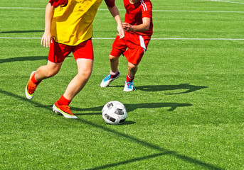 Young boys are playing soccer © majorosl66