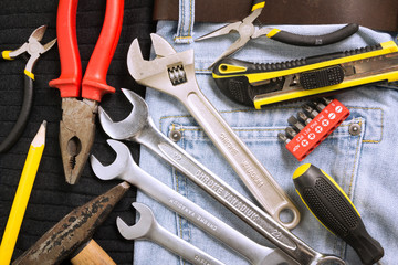 Toolkit in a blue jeans background