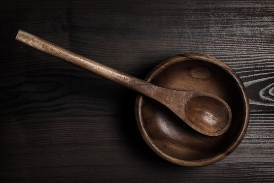 Salad Bowl And Spoon On Brown Table