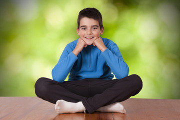 boy sitting looking at camera