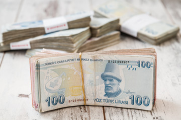 Bunch of Turkish Lira Money Banknotes on White Wooden Background