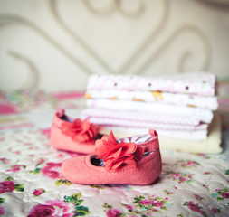 A beautiful gift for a newborn, diapers, pacifiers, peach shoes
