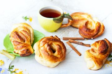 buns and cup of tea on tray