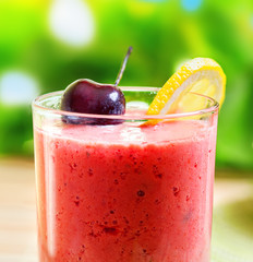 Summer drink, strawberry smoothie, outdoor