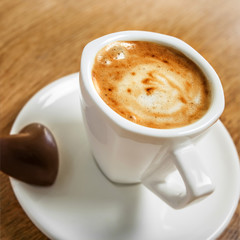 Cup of coffee with heart candy, love symbol