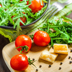 Vegetable salad with Parmesan on table
