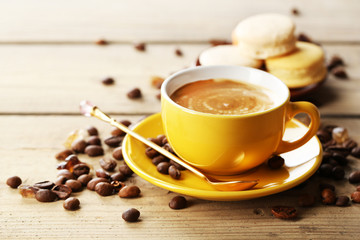 Gentle colorful macaroons and  coffee in mug