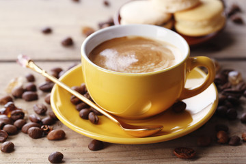 Gentle colorful macaroons and  coffee in mug
