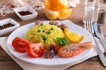 Seafood Paella on plate on table close-up