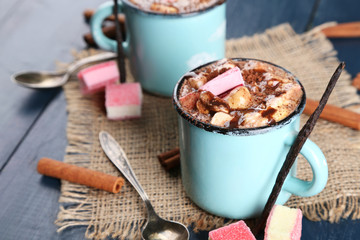 Mugs of hot coffee with marshmallow