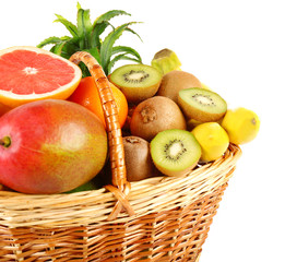 Assortment of fruits in basket isolated on white