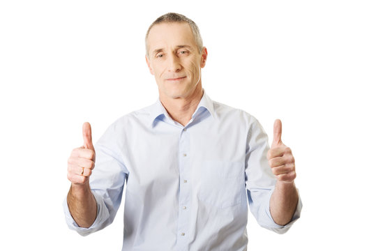 Mature man gesturing ok sign
