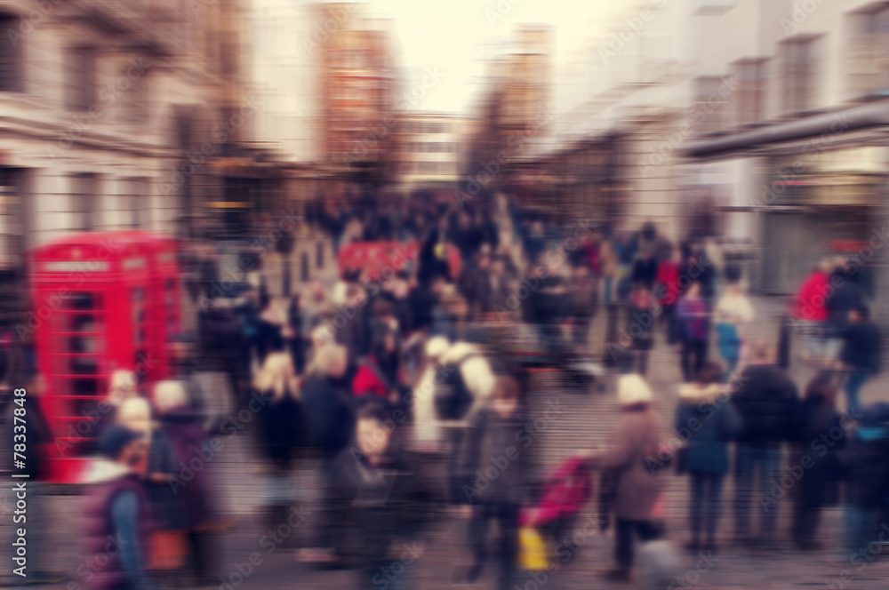 Wall mural defocused blur background of people walking in a street in Londo