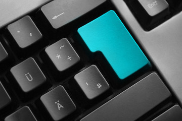 grey keyboard teal colored enter button