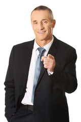 Portrait of businessman pointing on you