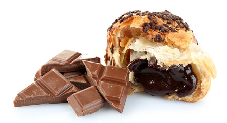 Fresh and tasty croissant with chocolate chunks, isolated