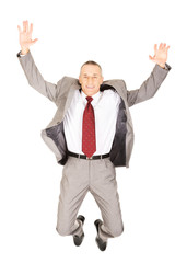 Excited businessman jumping because of success