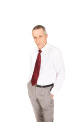 Confident businessman with hands in pockets
