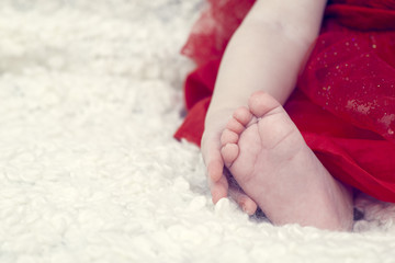 Baby holding his foot