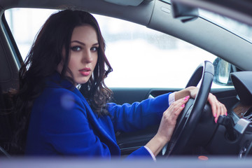 Attractive woman driving a car