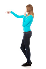 Surprised woman pointing to the left