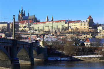 Fototapeta na wymiar Snowy Prague gothic Castle above River Vltava, Czech Republic