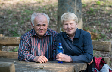 Older couple sitting on a bench